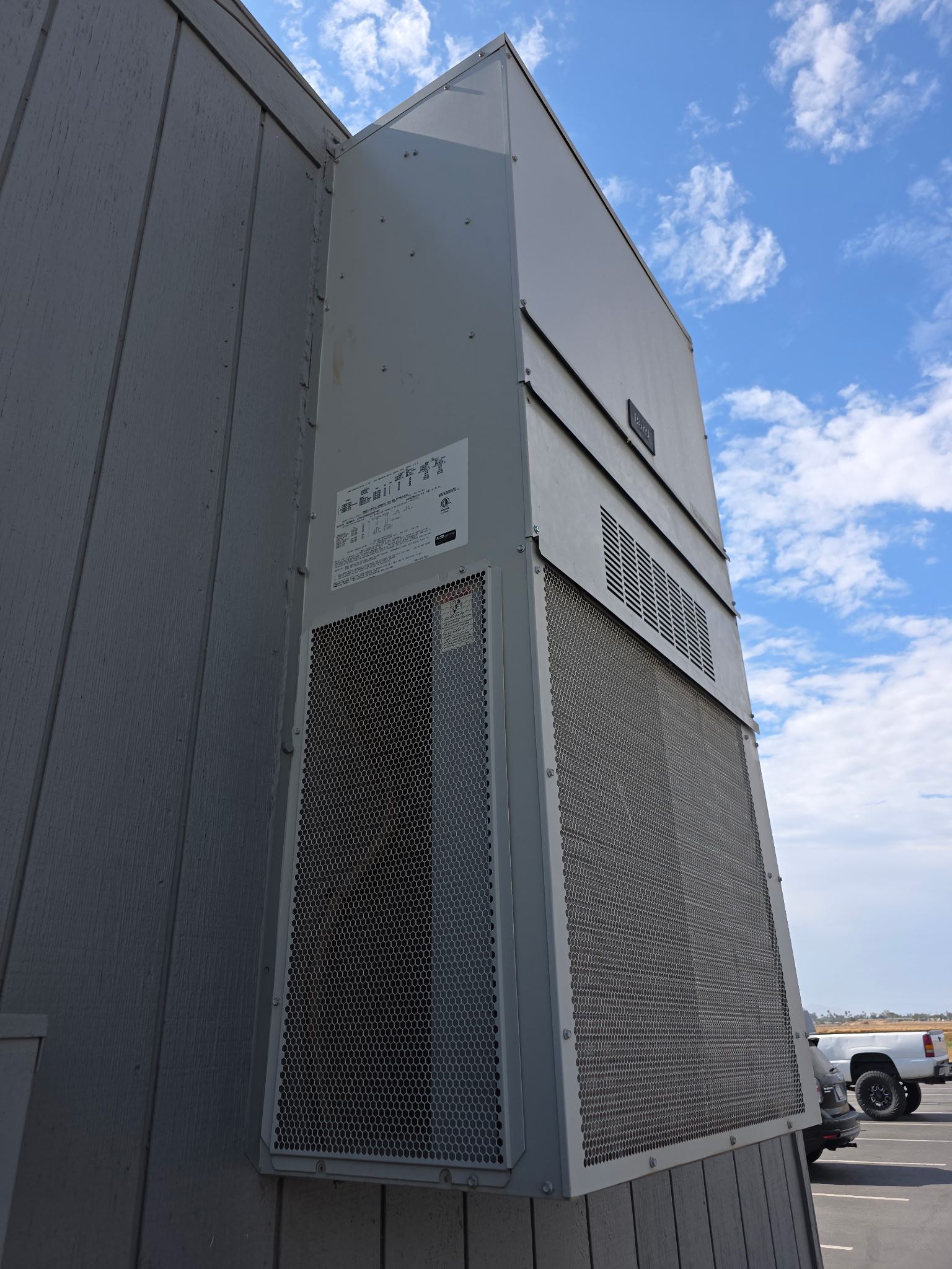 Exterior wall-mounted heating and cooling equipment.