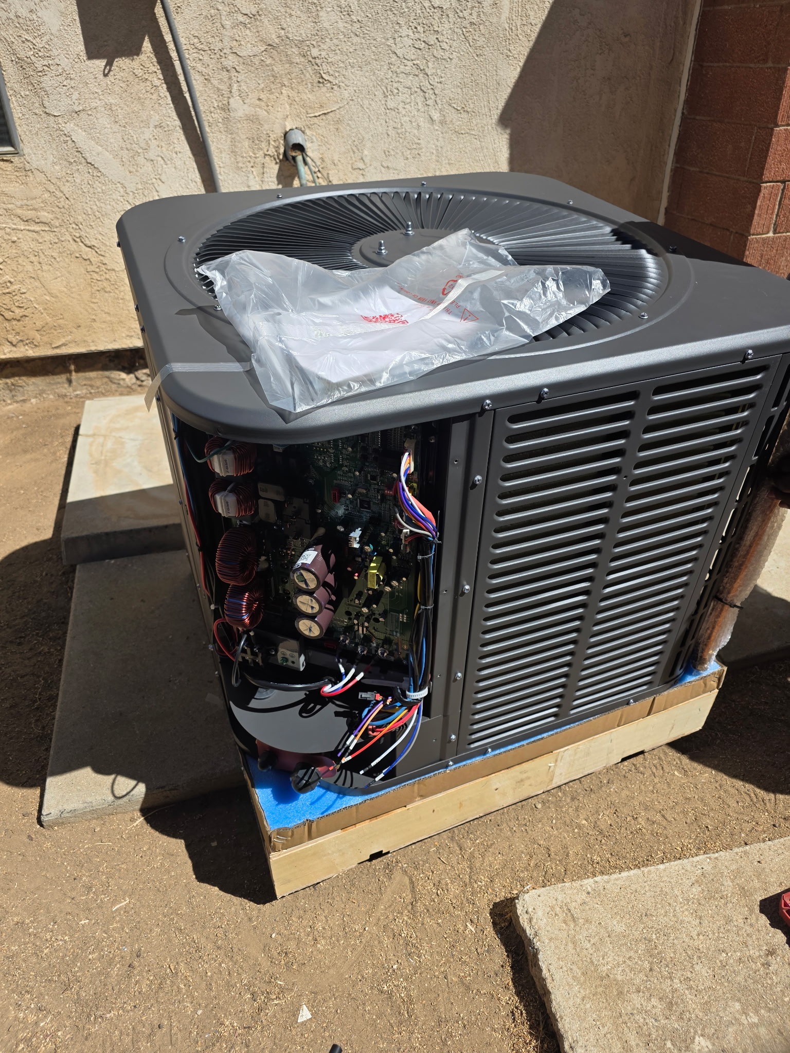 New outdoor equipment with its control compartment open during installation.