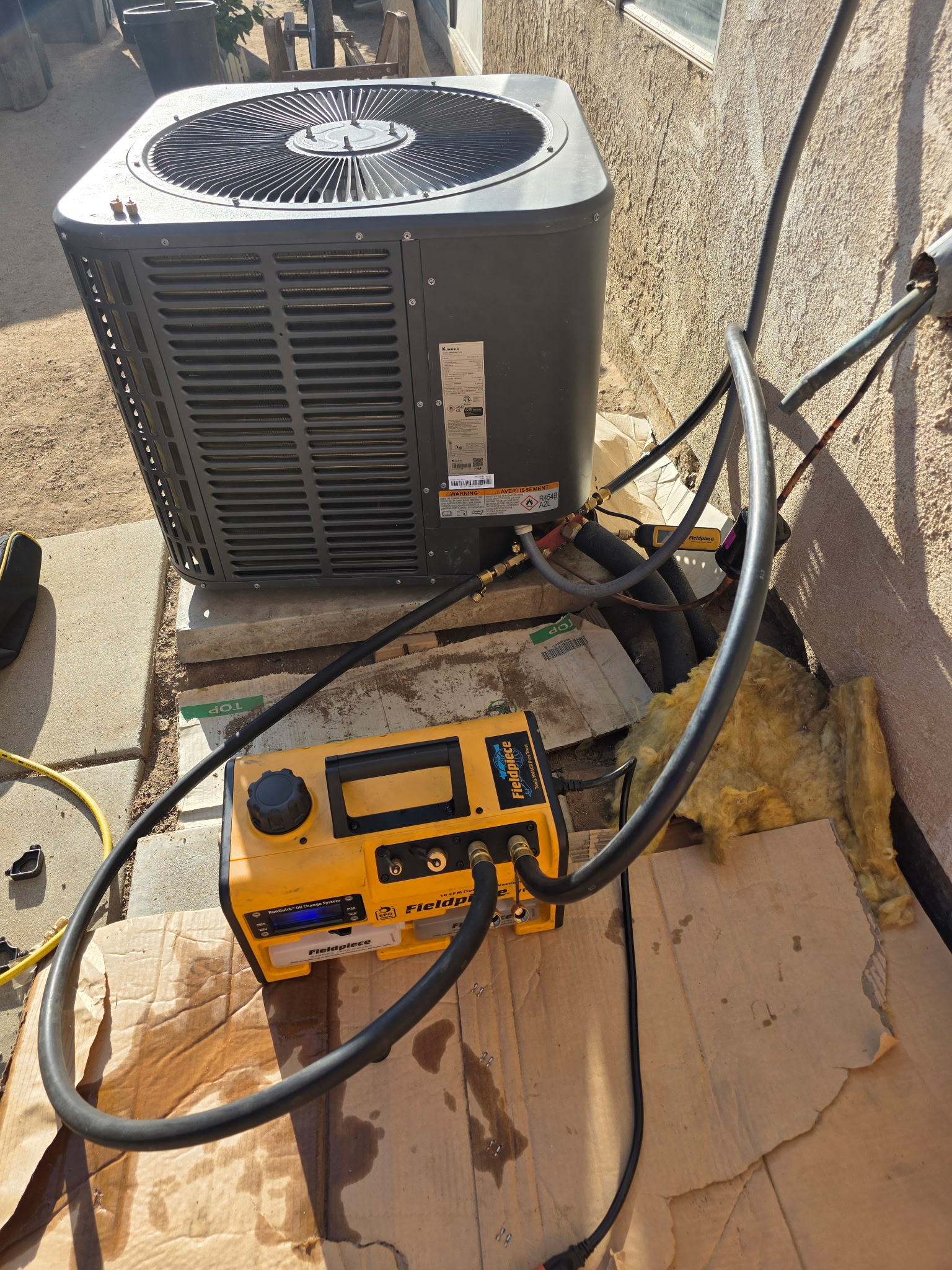 Outdoor condenser with service instruments connected.
